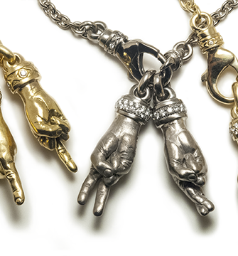The Horn, Servant, Peace Sign, Crossed Fingers and Gyan Mudra all in 750 Gold with VS Diamonds.